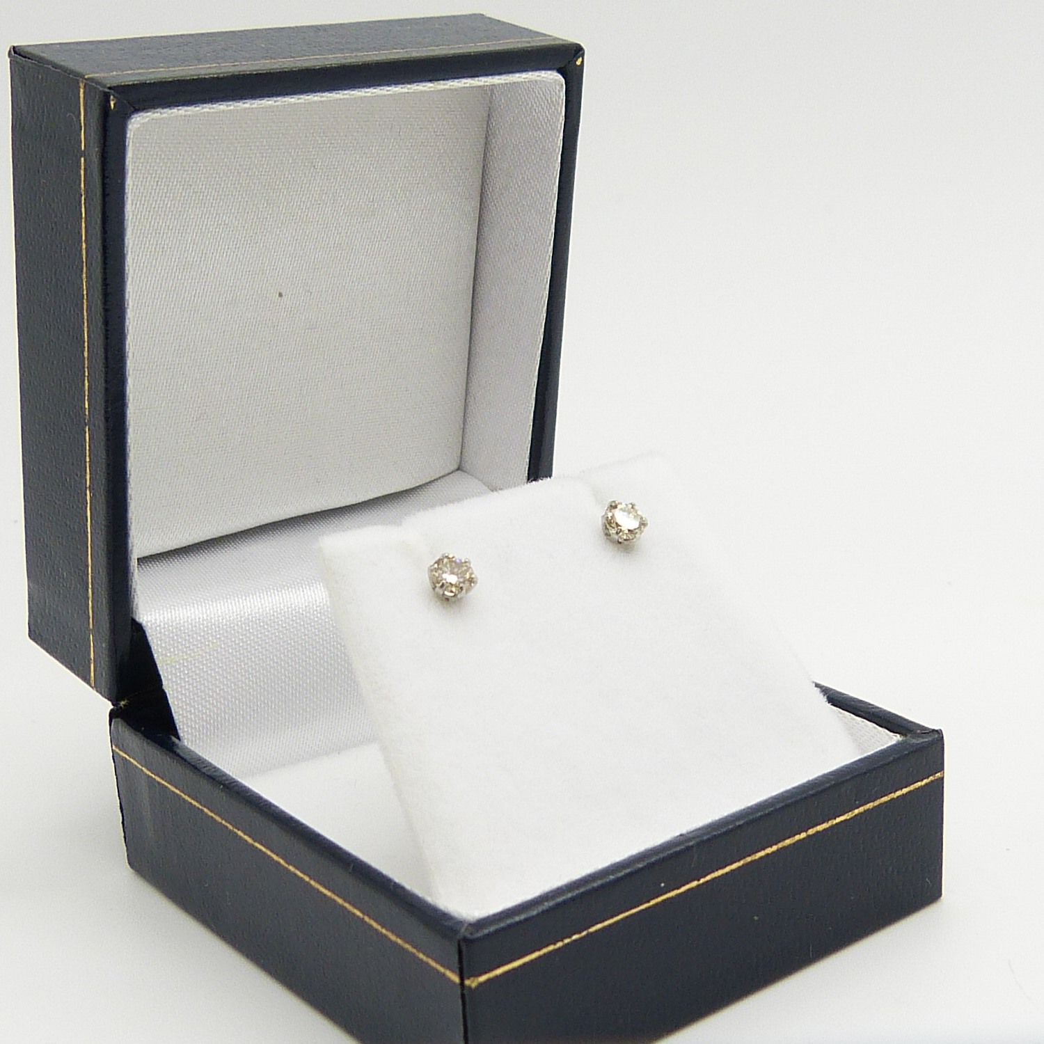 A pair of platinum 0.30 carat round brilliant-cut diamond solitaire ear studs, boxed - Image 7 of 7