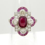 An Edwardian / Deco-style platinum ring set with rubies and diamonds