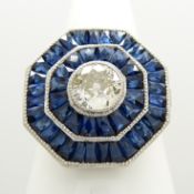 Platinum, octagonal, old-cut diamond and calibre-cut sapphire double halo ring