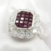 An attractive 18ct white gold invisible-set ruby and diamond cluster ring