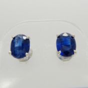 A pair of silver ear studs set with deep blue kyanite gemstones