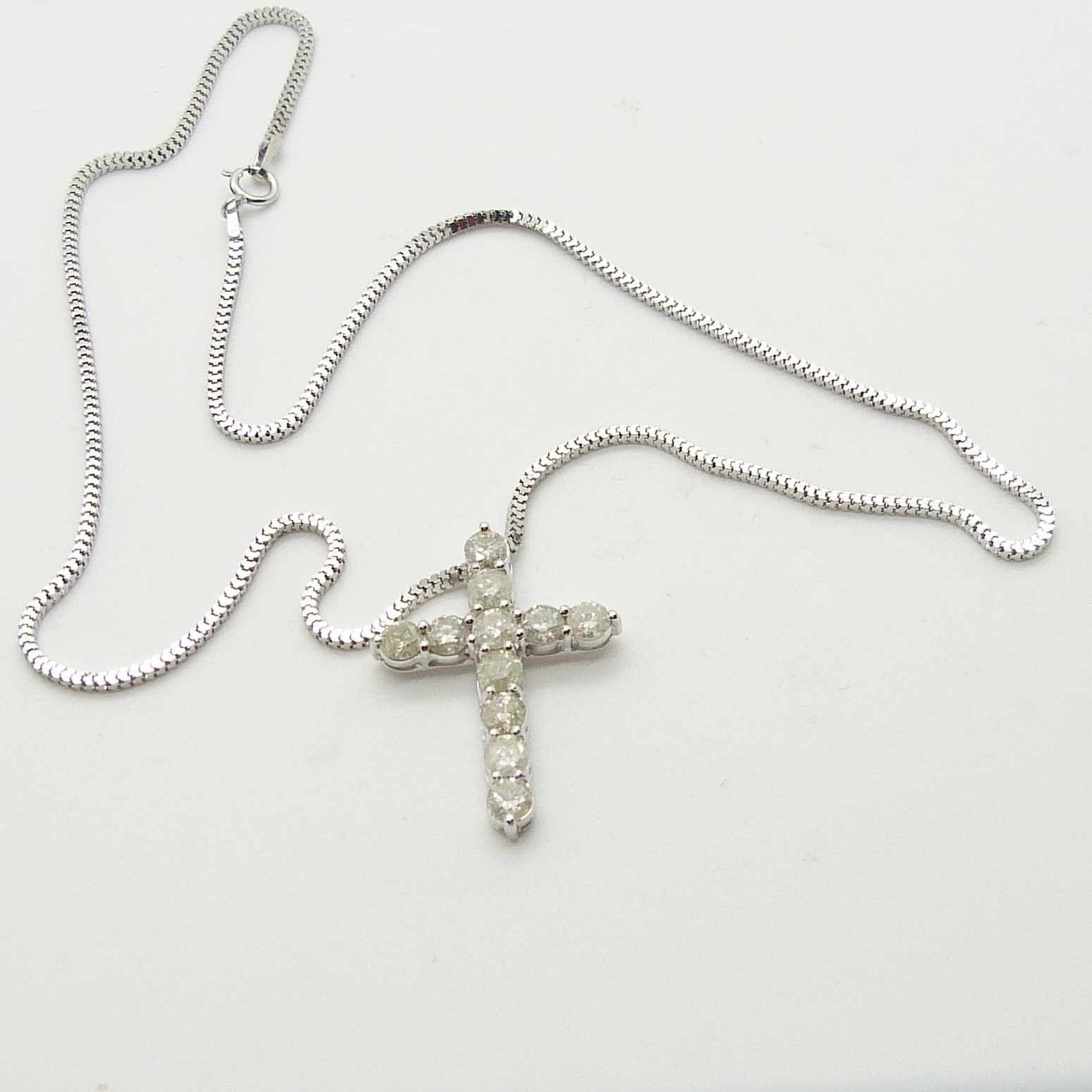 A 14ct white gold diamond cross pendant on a silver snake link chain, boxed - Image 2 of 6