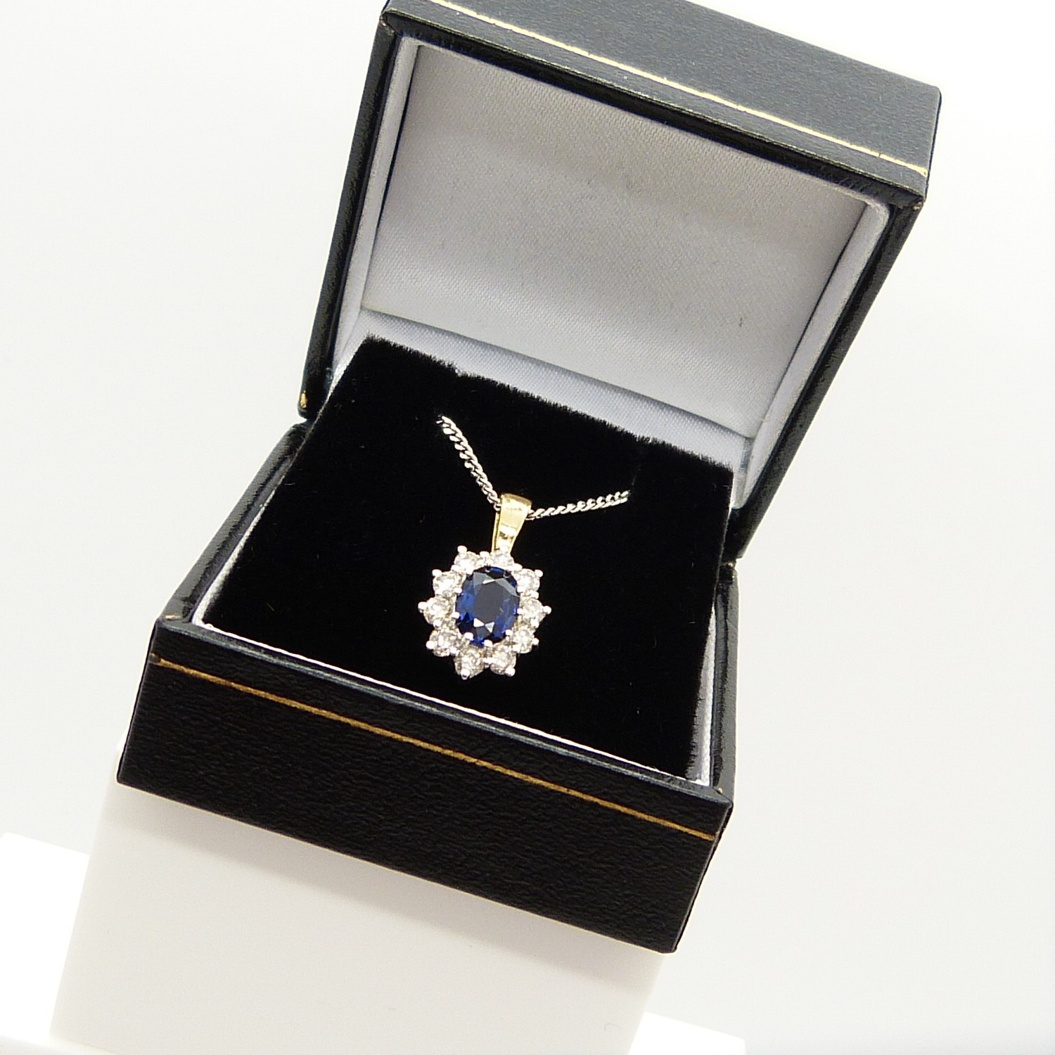 An 18ct yellow and white gold sapphire and diamond cluster pendant on a silver chain, boxed - Image 4 of 7