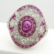 A stylish, ornate platinum ruby and diamond dress ring