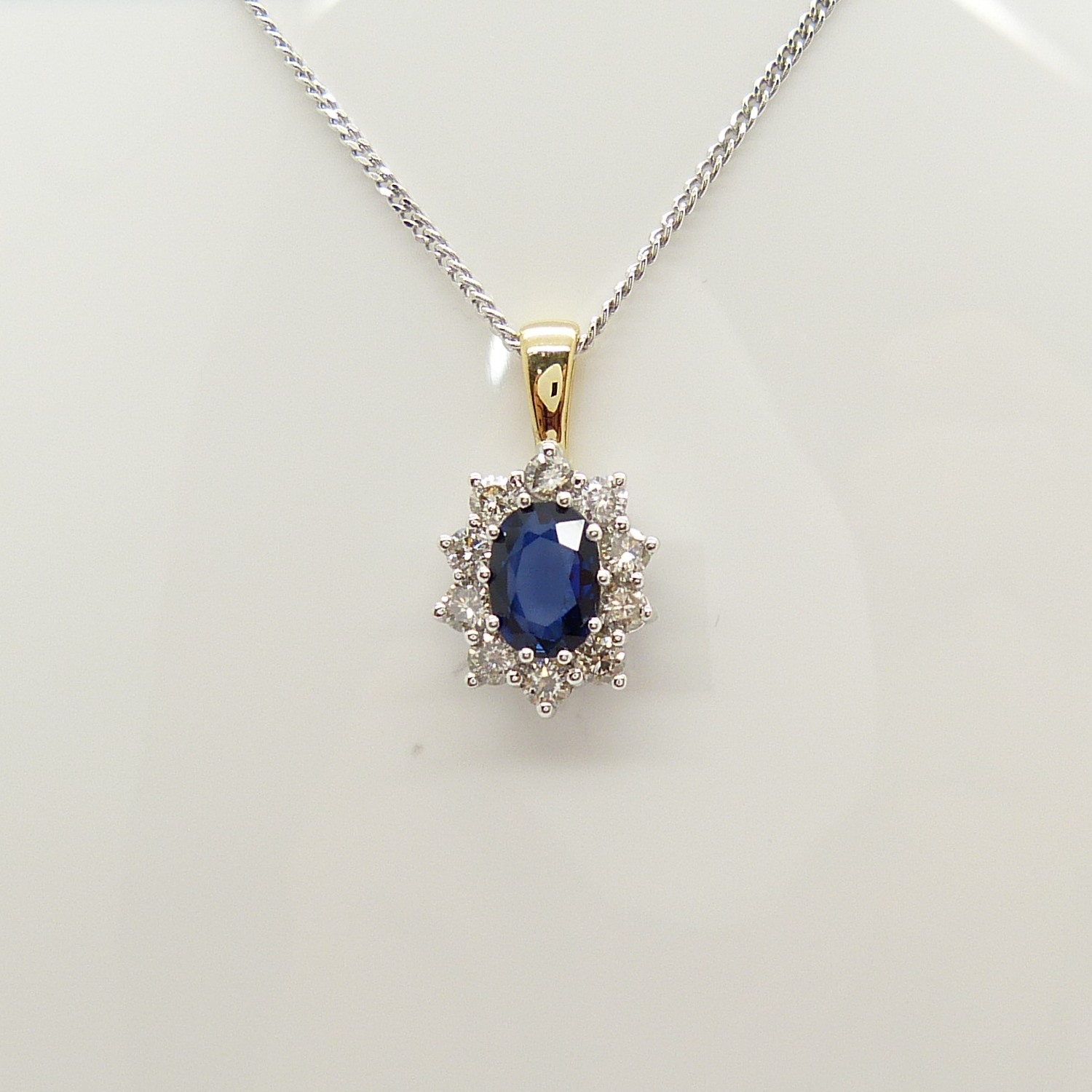An 18ct yellow and white gold sapphire and diamond cluster pendant on a silver chain, boxed - Image 3 of 7