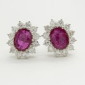 A pair of 18ct white gold large ruby and diamond cluster ear studs, boxed