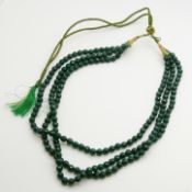 A necklace strung with earth-mined faceted emerald gemstones totalling 490.00 cts (approx)
