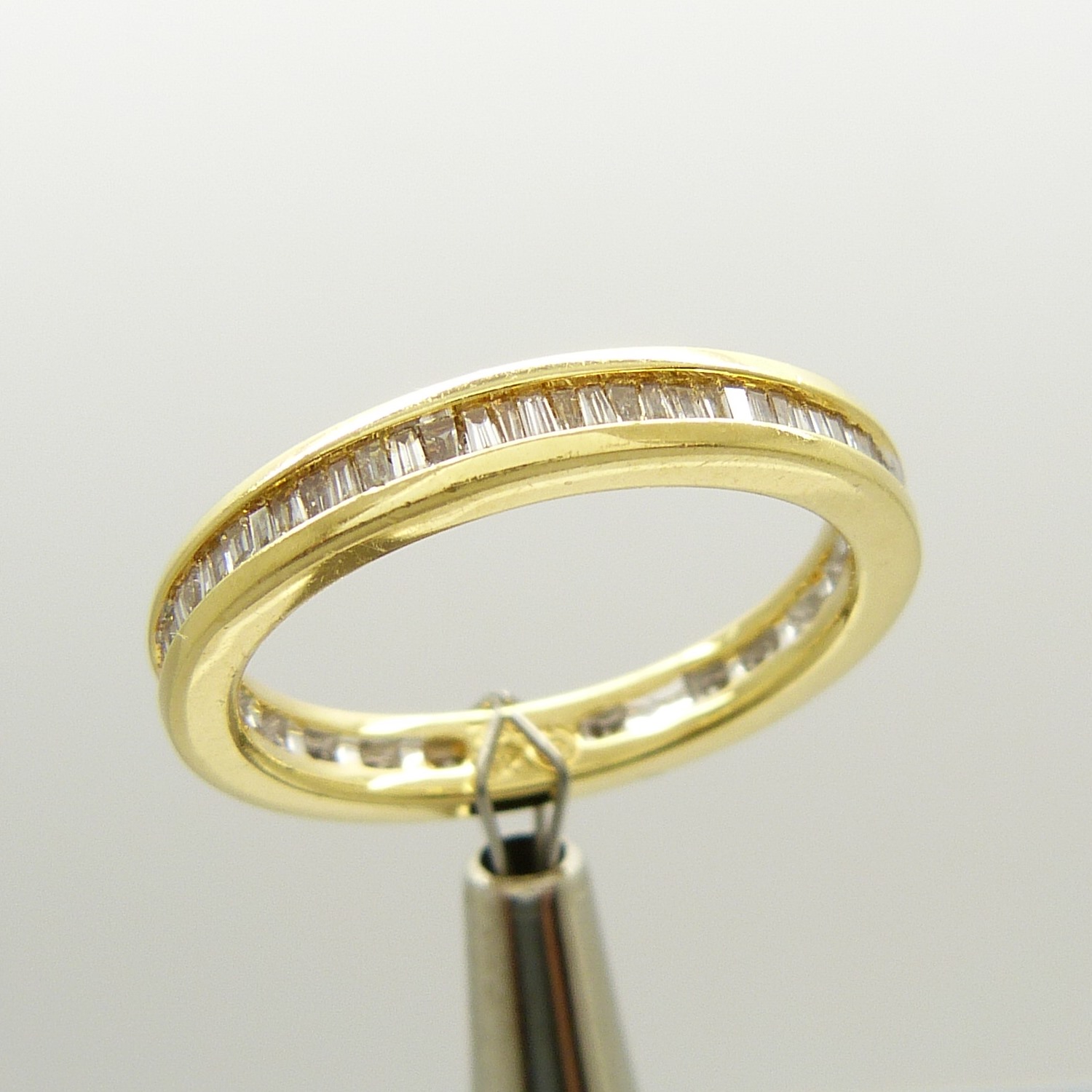 An 18ct yellow gold full eternity ring set with 0.50 carats of tapered baguette diamonds, certified - Image 2 of 7