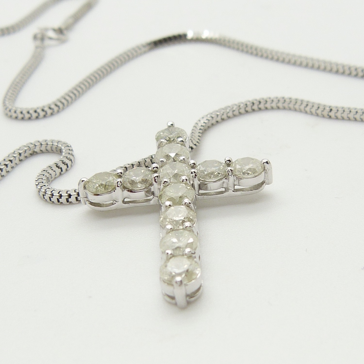 A 14ct white gold diamond cross pendant on a silver snake link chain, boxed - Image 6 of 6