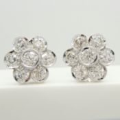 A dazzling pair of daisy-style 2.96ct diamond cluster earrings in 18ct white gold, boxed