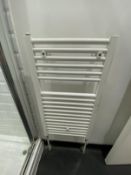 Bathroom white towel heater radiator.