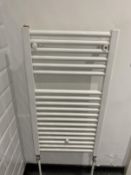 Bathroom white towel heater radiator.