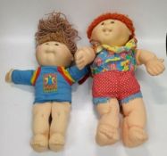 A Pair Of Vintage First Edition Cabbage Patch Dolls 1990
