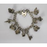 Vintage Silver Charm Bracelet with 11 Charms