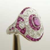 A stylish, ornate platinum ruby and diamond dress ring