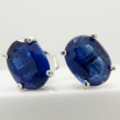 A pair of silver ear studs set with deep blue kyanite gemstones