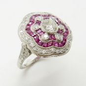 A platinum floral-styled 1.75 carat diamond and 1.45 carat ruby cocktail ring