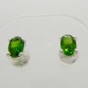 A pair of oval green chrome diopside ear studs in silver