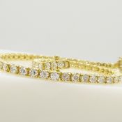 A striking 3.22 carat round brilliant-cut diamond tennis bracelet in 18ct yellow gold, boxed