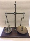 Brass weighing scales on wooden base