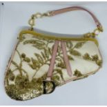 Dior Saddle MiniClutch Limited edition in gold coloured embroidery over cream satin