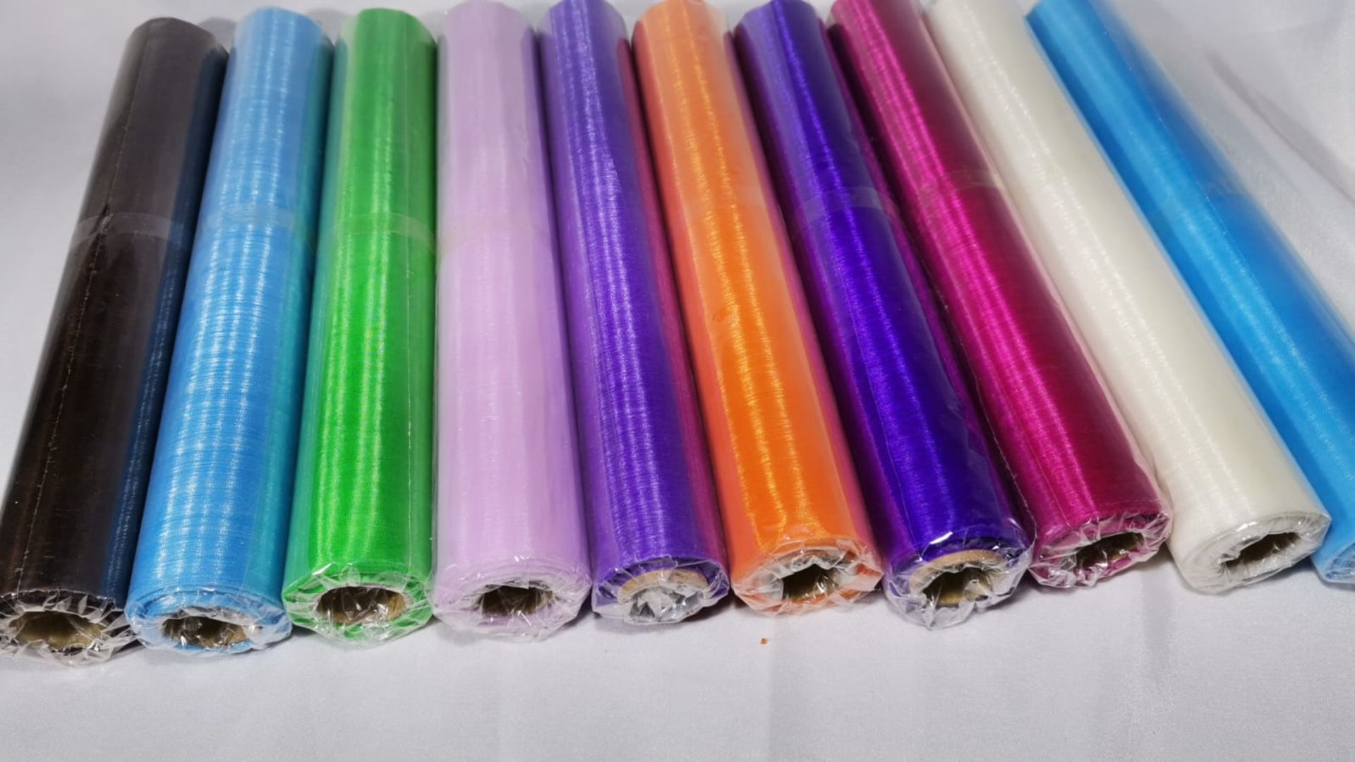 10 Rolls of 10m Mixed Colour Sheer Organza Material. RRP £70