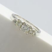 A 0.75 carat graduated princess-cut 3-stone diamond ring in 18ct white gold