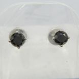 A pair of unusual 18ct white gold 1.00 carat black diamond ear studs, boxed