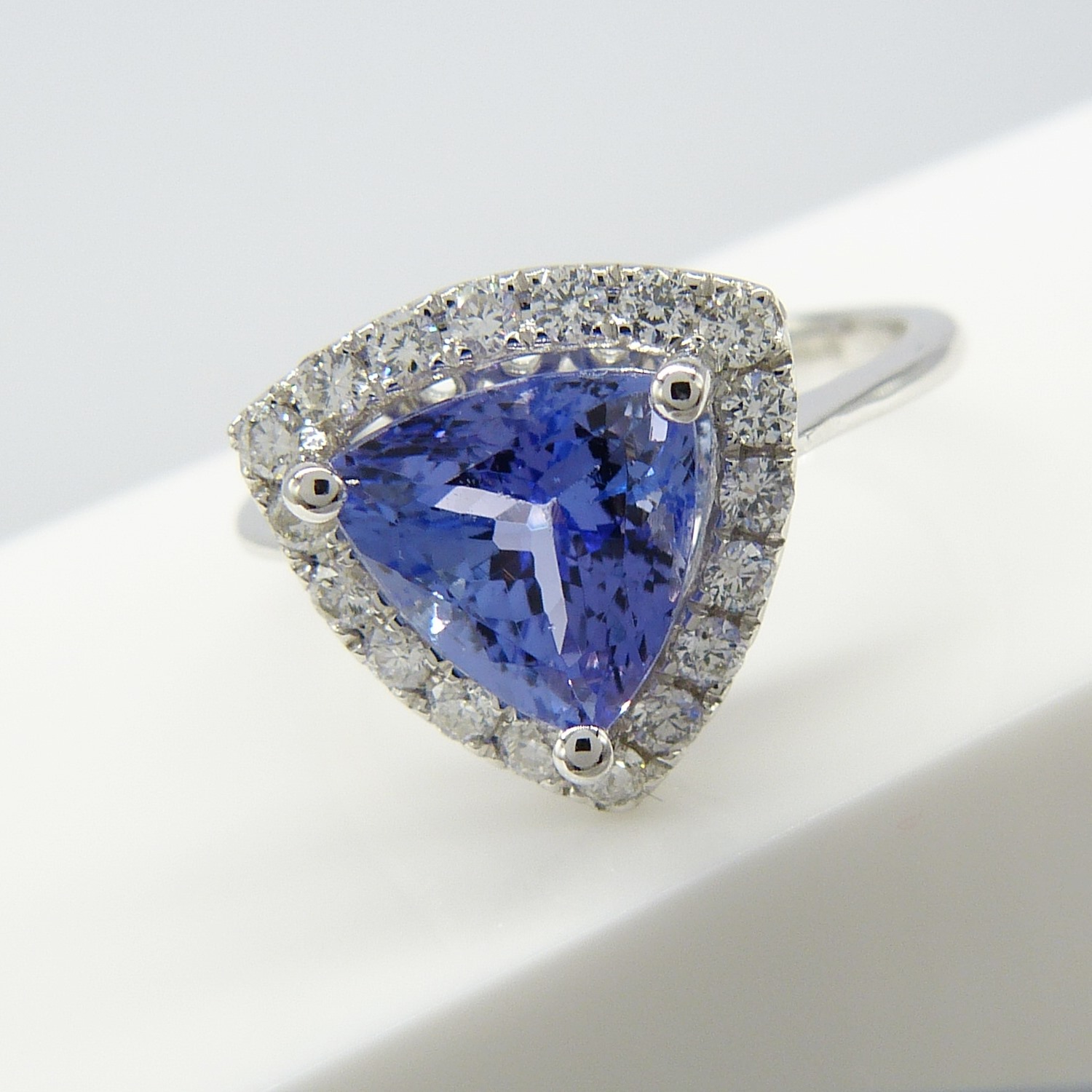 A superb 1.88ct trilliant-cut tanzanite and diamond halo dress ring in 18ct white gold - Image 4 of 7