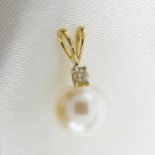 A cultured pearl and diamond pendant in 18ct yellow gold