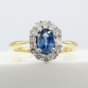 A stylish 18ct yellow and white gold cornflower blue sapphire and diamond cluster ring