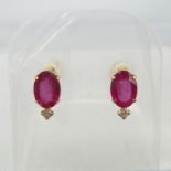 A pair of 18ct yellow gold oval-cut ruby and diamond ear studs, boxed