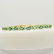 A stunning 9.35 carat emerald and 1.00 carat diamond line bracelet in 18ct yellow gold, certificated