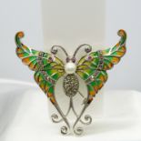 A large silver plique-à-jour butterfly brooch / pendant with a pearl, rubies and marcasites