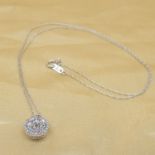 A dazzling 0.50 carat diamond cluster necklace in 10ct white gold, boxed