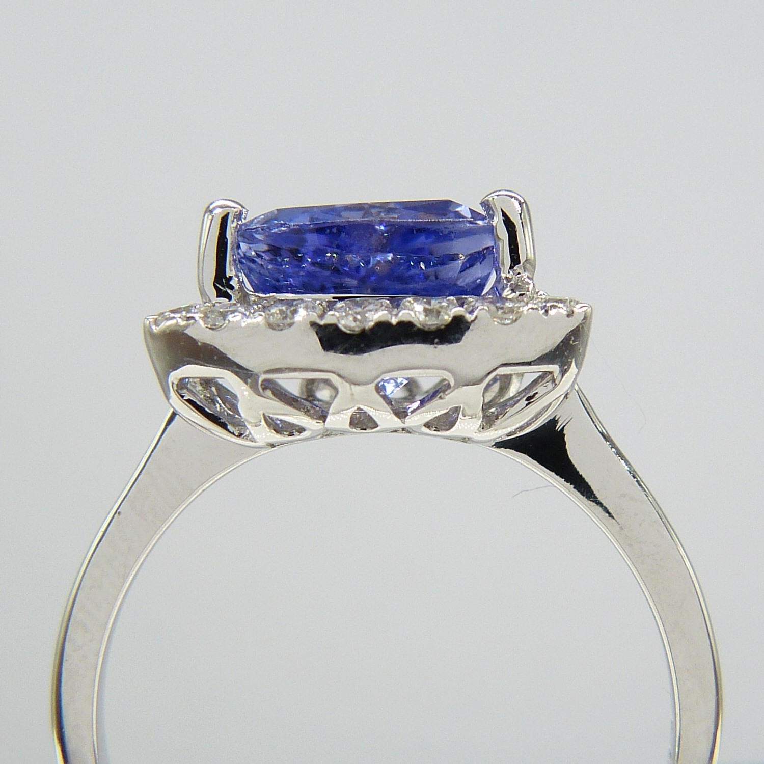 A superb 1.88ct trilliant-cut tanzanite and diamond halo dress ring in 18ct white gold - Image 7 of 7