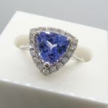 A superb 1.88ct trilliant-cut tanzanite and diamond halo dress ring in 18ct white gold