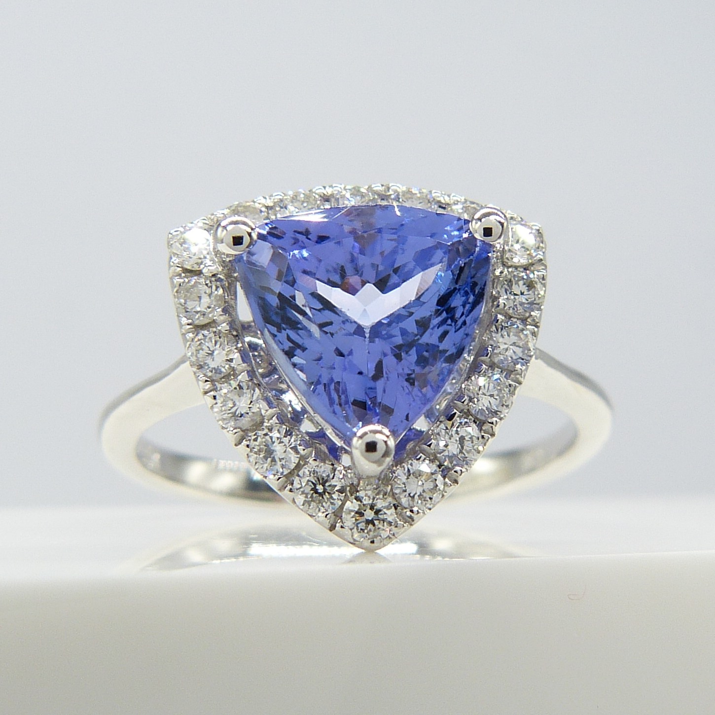 A superb 1.88ct trilliant-cut tanzanite and diamond halo dress ring in 18ct white gold - Image 3 of 7