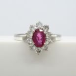 A ruby and diamond (F-G colour) cluster ring in 18ct white gold, with certificate