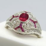 A platinum Victorian-style ruby and diamond ring in a filigree-style mount