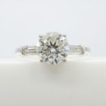 A fine quality 1.57ct diamond solitaire ring with 0.22ct diamond shoulders in 18ct white gold