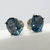 Oval-cut London blue topaz ear studs in silver