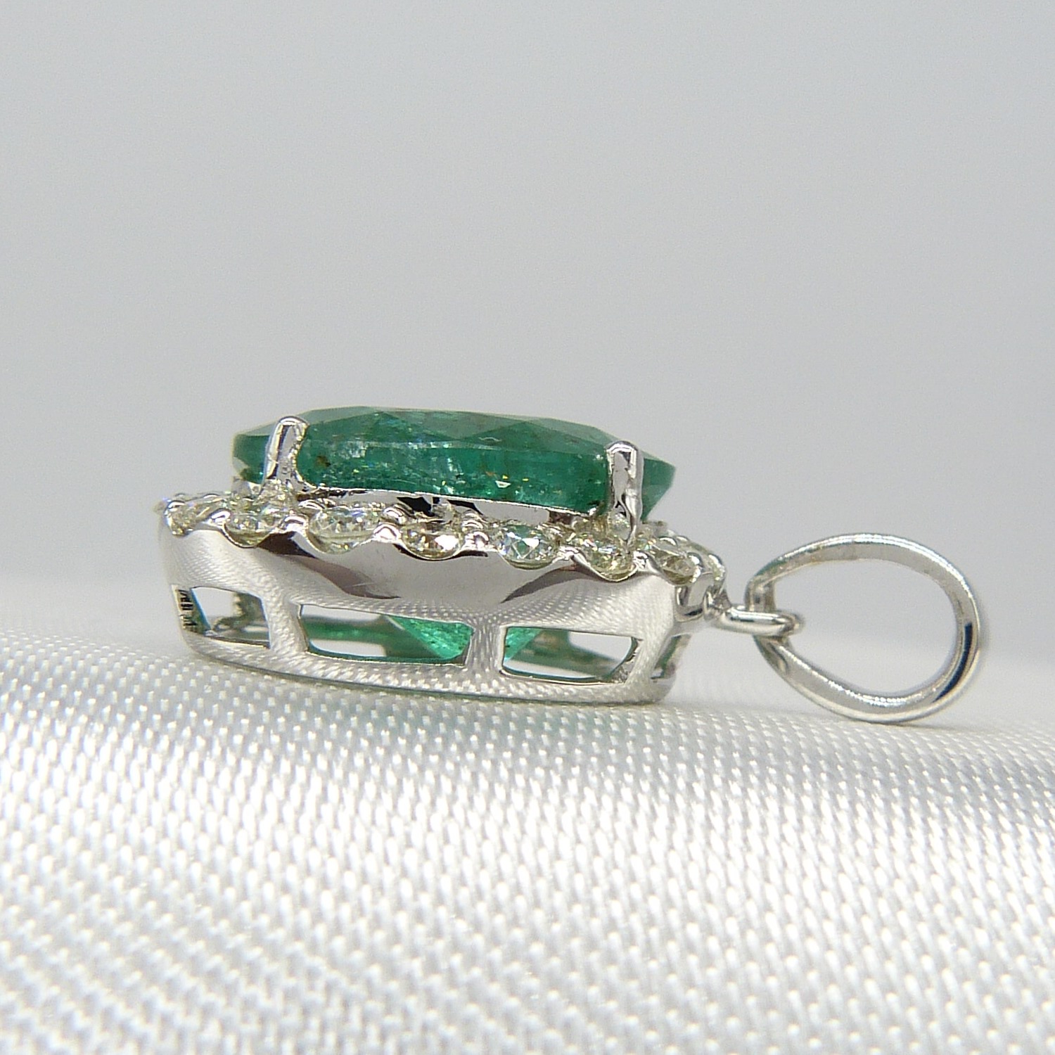 A large emerald and diamond halo pendant in 18ct white gold - Image 7 of 7