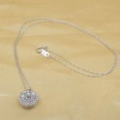 A dazzling 0.50 carat diamond cluster necklace in 10ct white gold, boxed