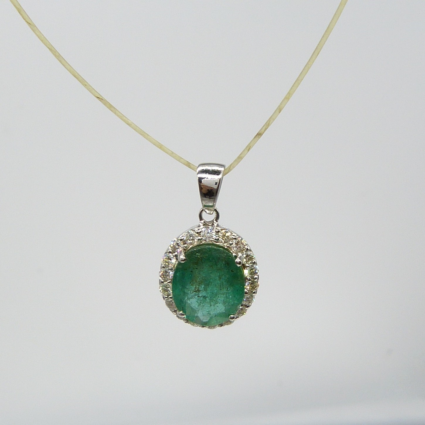 A large emerald and diamond halo pendant in 18ct white gold - Image 2 of 7