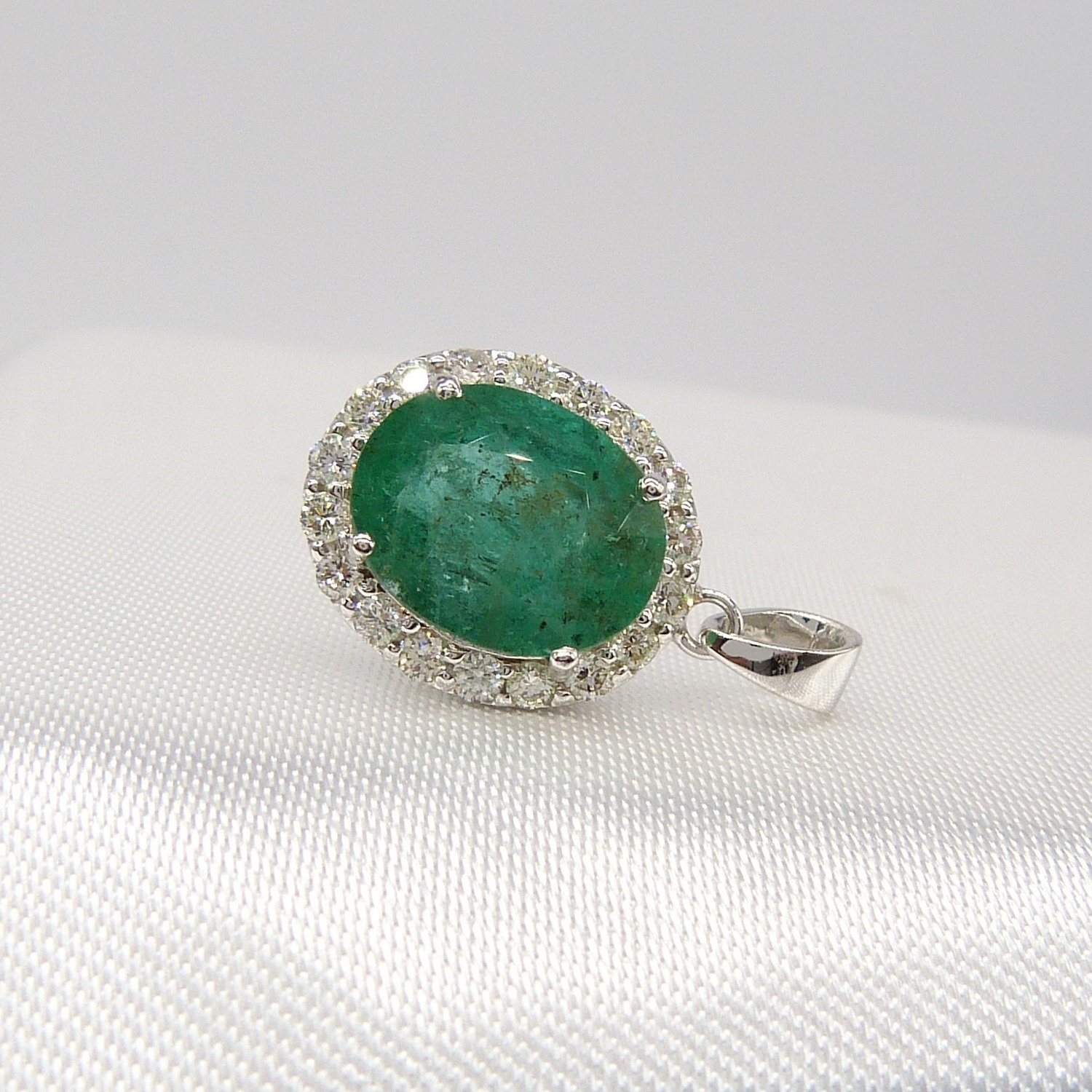 A large emerald and diamond halo pendant in 18ct white gold - Image 4 of 7