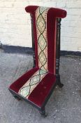 A Victorian Prei Dieu upholstered in red velvet and embroidered runner, ebonised mahogany