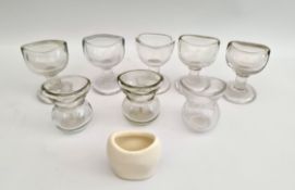 Vintage Antique 8 x Clear Glass Eye Baths and 1 Ceramic. The tallest measures 2.5 inches tall.