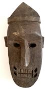 Vintage African Wood Tribal Mask. Measures 12 inches long.