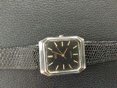 Q & Q Unisex Wristwatch with Black Leather Strap (GS 137) Q & Q Unisex Wristwatch with a